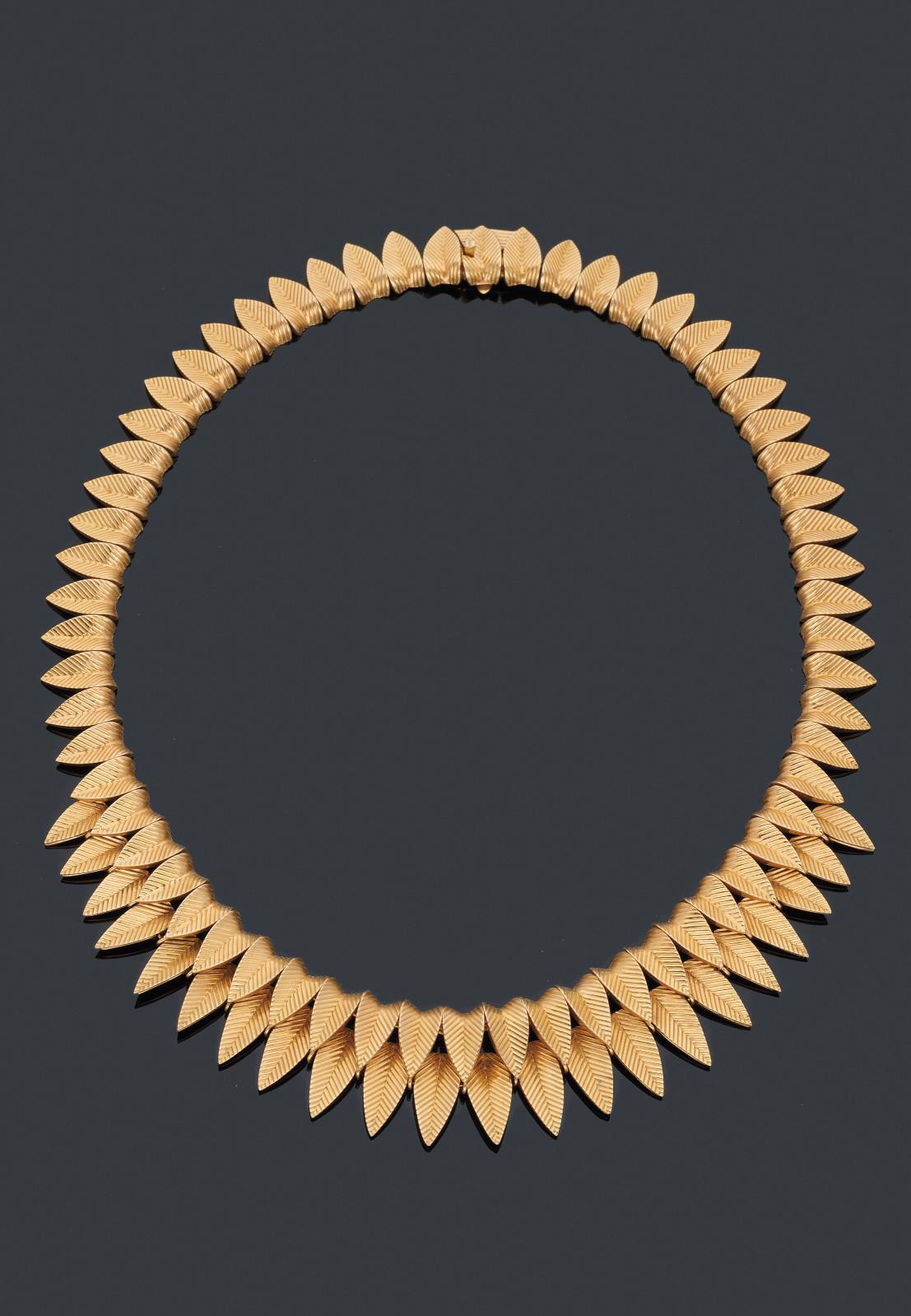 A Gold Necklace By Cartier