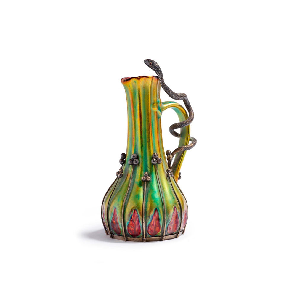 €12,160Vilmos Zsolnay and Oscar Julius Dietrich (1853–1940), c. 1898–1900, ceramic ewer with iridescent glaze on a plant-shaped body, silv
