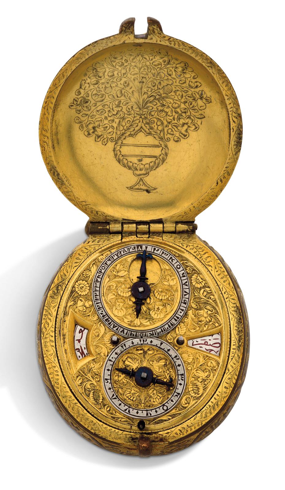 Travail suisse, milieu du XVIIe siècle, montre ovale astronomique en métal doré fabriquée pour le marché ottoman, décor de feuillages et d