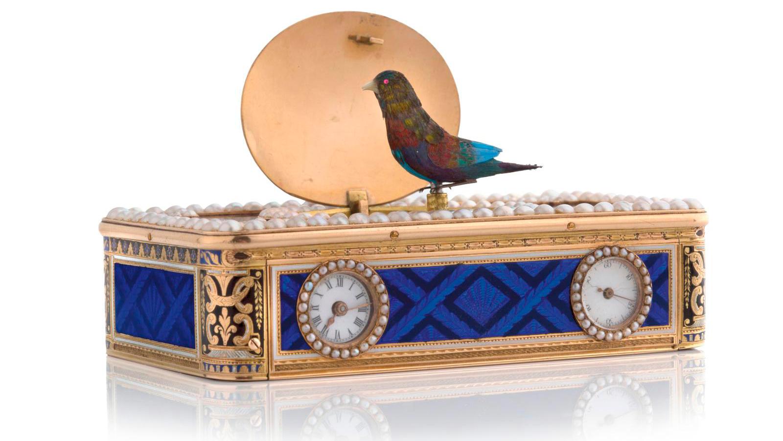 How do antique singing bird music boxes work?