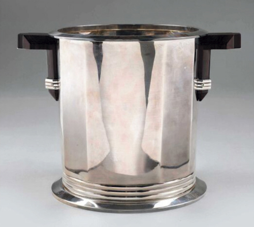 €34,500Jean Puiforcat (1897-1945), silver champagne bucket with rosewood handles, h. 22 cm/8.66 in., gross weight 2,714 g/95.73 oz.Paris, 