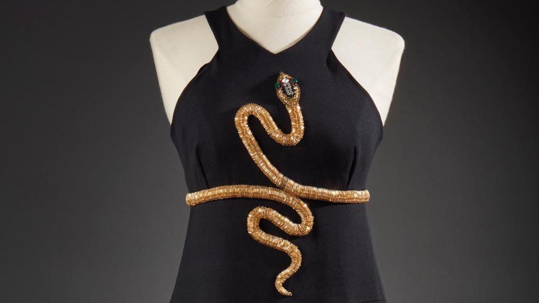 €4,894Chloé by Karl Lagerfeld, black wool dress highlighted by a snake in gold, baguette... Art Price Index: The Snake, the Most Beautiful Ornament 