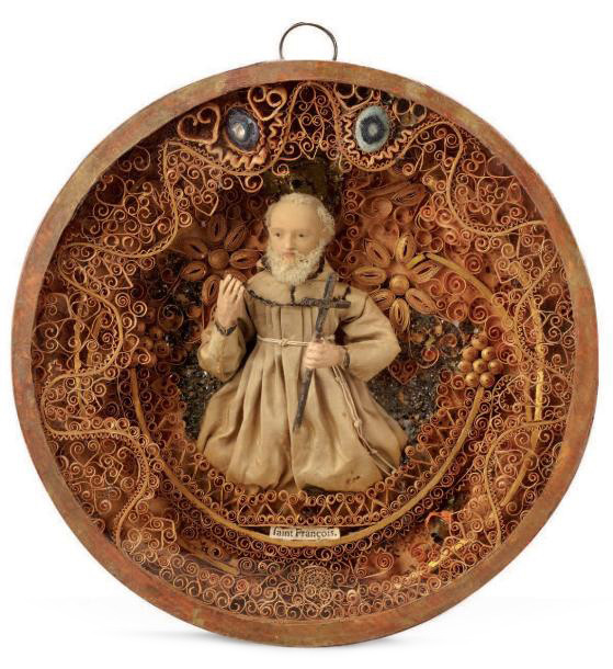 701 € Fin XVIIIe-début XIXe siècle, paperolle représentant le buste de saint François en cire, diam. 19 cm. Drouot, 6 juin 2013. Aguttes OVV.