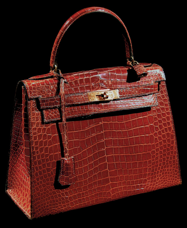 Hermès, sac Kelly en crocodile cognac, fermoir en plaqué or, poignée, h. 29 cm.Paris, Gros et Delettrez, 17/1/2005.6 500 €