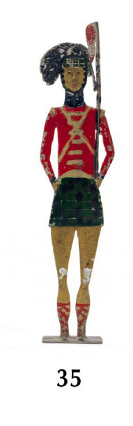Figurine plate représentant un soldat écossais au fixe, h. 15 cm, époque premier Empire.Drouot, 20 janvier 2010. Fraysse & Associés OVV. M. Blondieau.