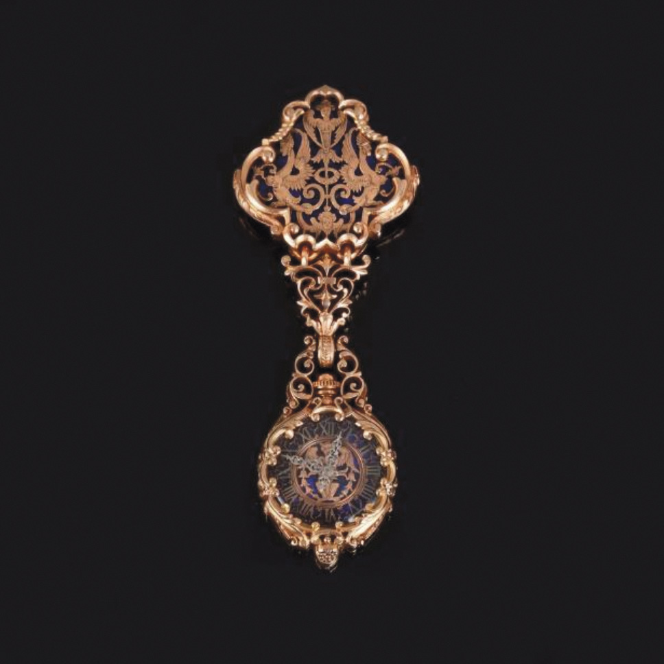 €9,375Frédéric Boucheron, second half of 19th century, chased openwork gold chatelaine holding an enameled pendant gold watch, gross weigh