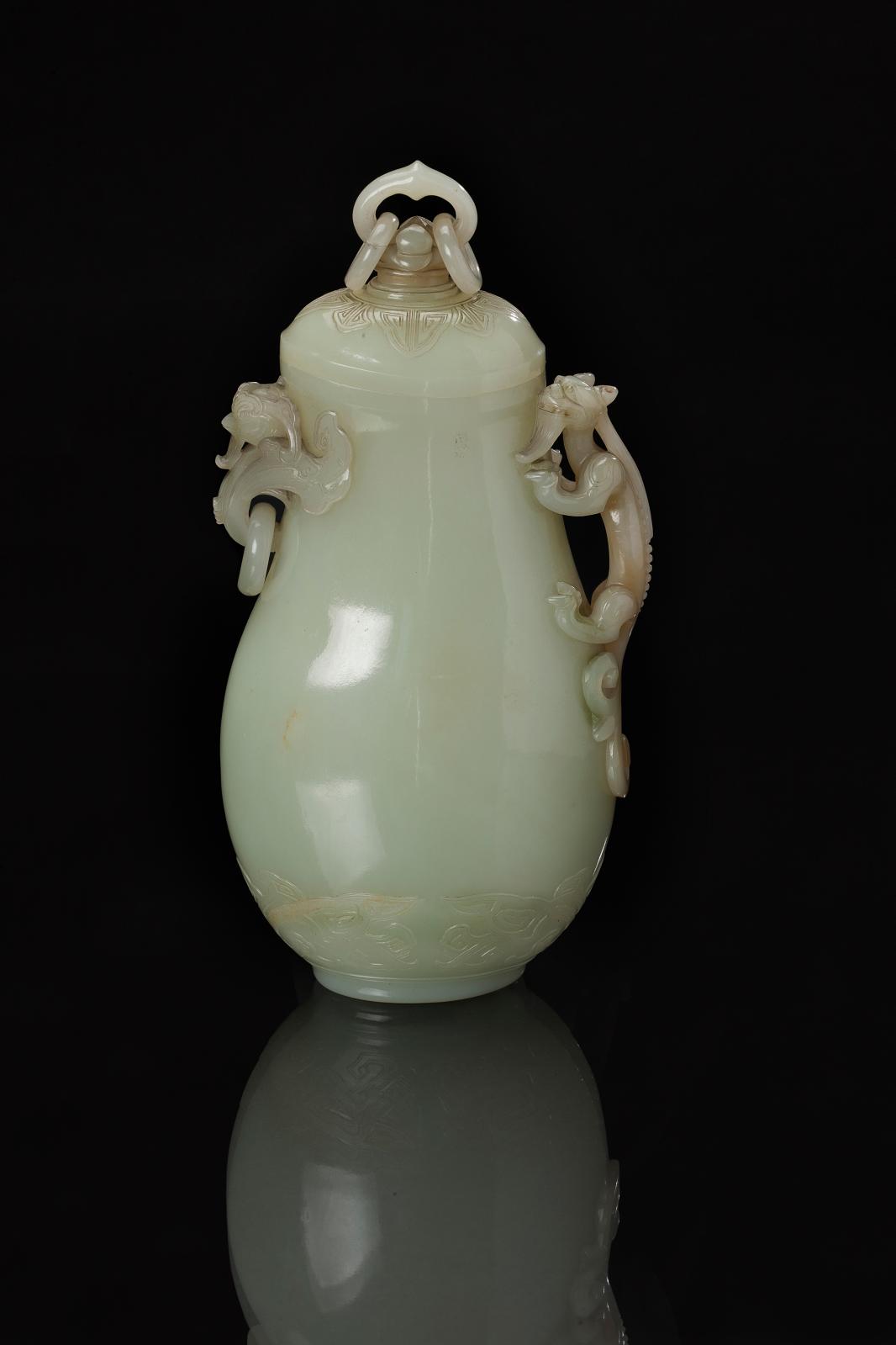 €667,120 China, Qianlong period, 18th century, lidded vase in white jade, handle formed by a chilong carved in the round, phoenix in high relief, h. 2