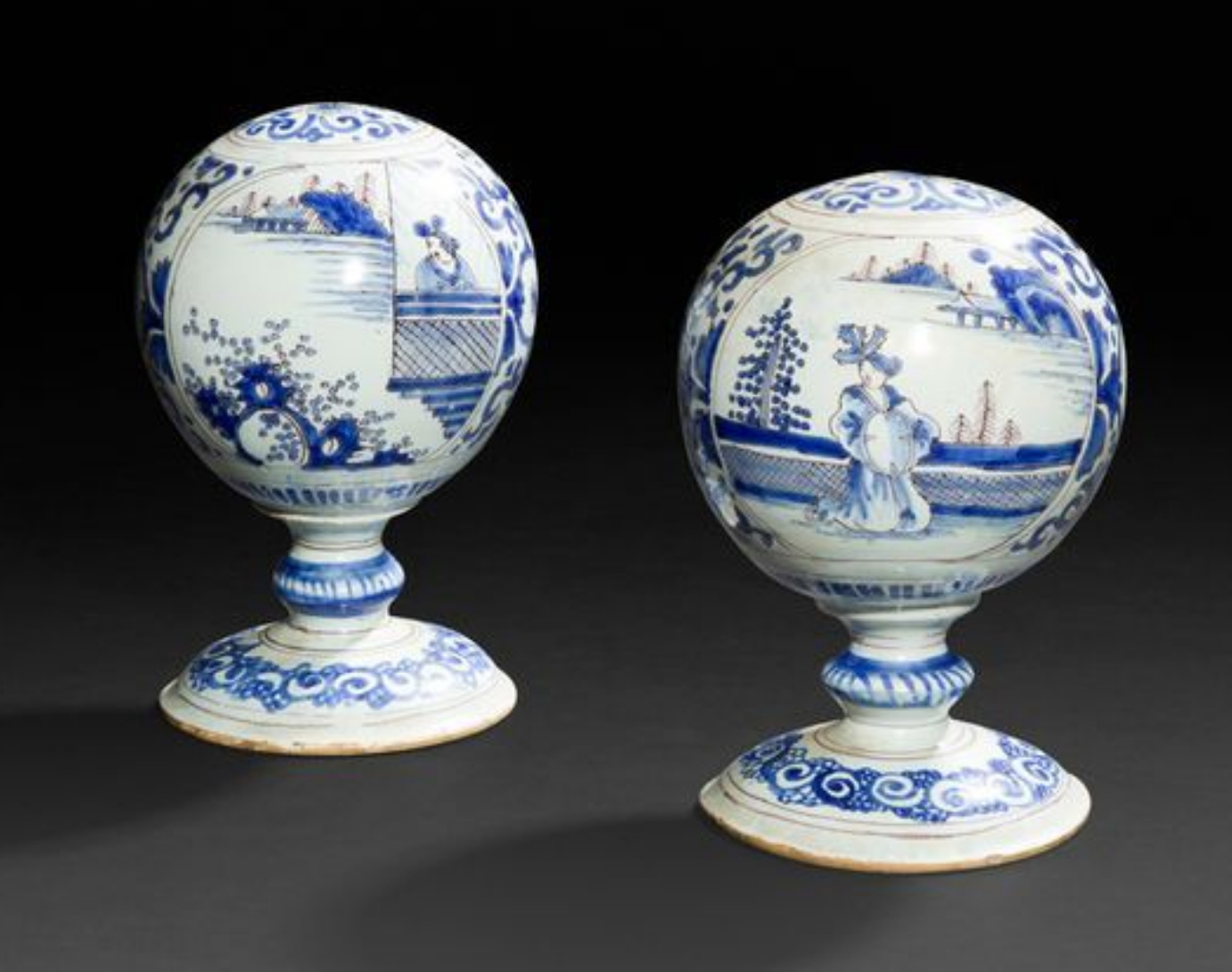 €5,376Nevers, c. 1680. Pair of faïence wig stands decorated with monochrome blue Chinese figures in landscapes, h. 15 cm/5.90 in. Paris, D