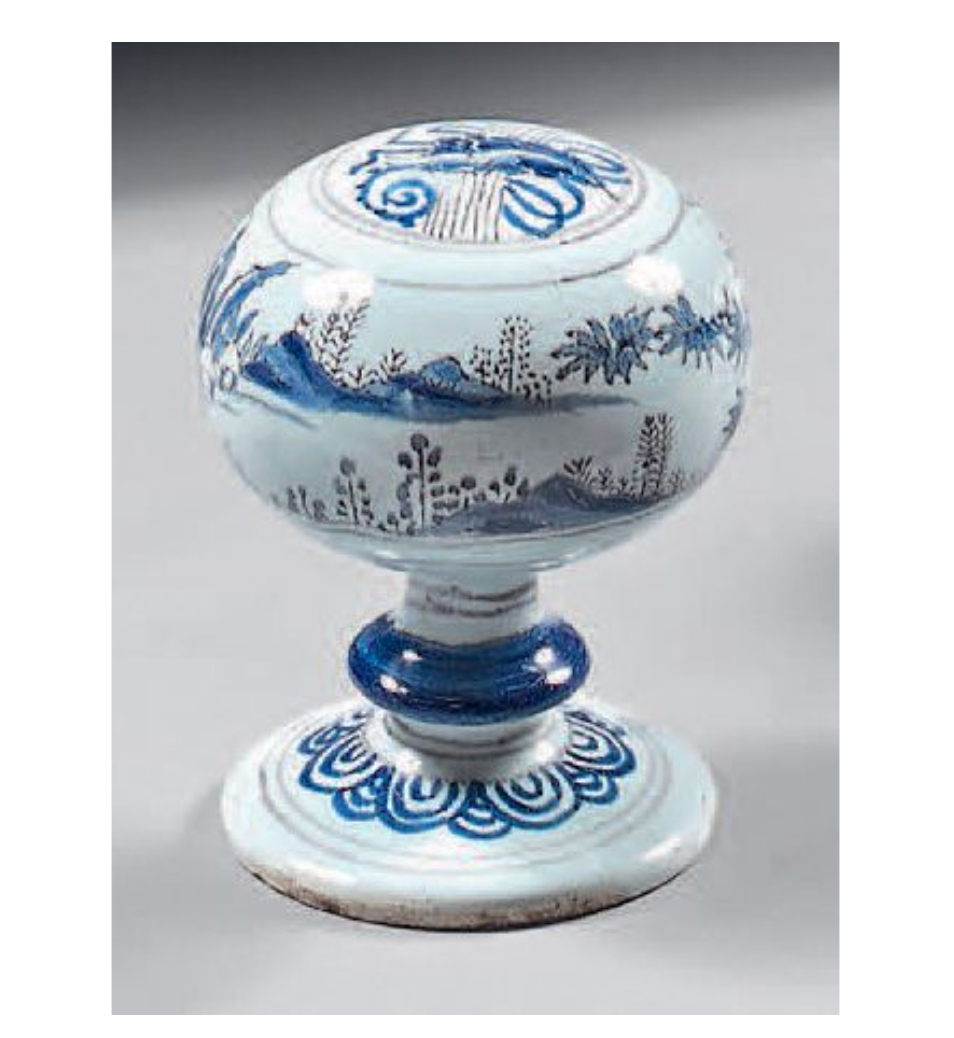 €1,674Nevers, second half of the 17th century. Faïence wig stand decorated with blue and manganese landscapes and a Chinese symbol, h. 12.