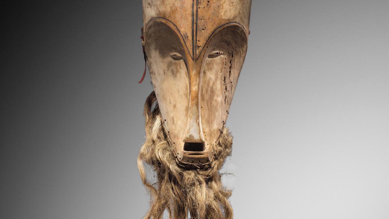 Mask of the Ngil society, Fang people, Gabon, late 19th century, kapok wood, kaolin,... Ngil Mask: The Uniform of Power in Fang Society